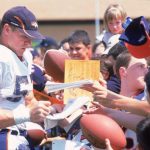 26 Jul 2000:  Bill Romanowski #53 of the Denver Broncos signs autographs for young fans during the Bronco's Training Camp at the University of Northern Colorado in Greely, Colorado.Mandatory Credit: Brian Bahr  /Allsport