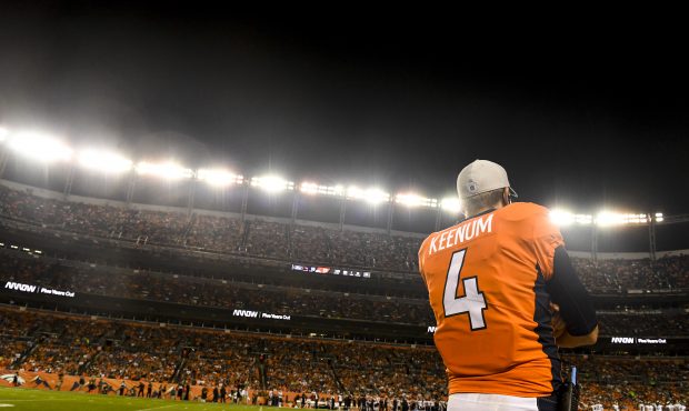 Case Keenum (4) of the Denver Broncos watches the action against the Chicago Bears during the secon...