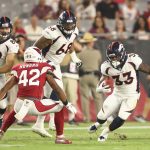 Running back De'Angelo Henderson (33) of the Denver Broncos rushes the football against defensive back A.J. Howard (42) of the Arizona Cardinals during the preseason NFL game at University of Phoenix Stadium on Aug. 30, 2018 in Glendale, Arizona.  (Photo by Christian Petersen/Getty Images)