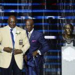 CANTON, OH - AUGUST 7: Floyd Little and his presenter, son Marc, look on during the 2010 Pro Football Hall of Fame Enshrinement Ceremony at the Pro Football Hall of Fame Field at Fawcett Stadium on August 7, 2010 in Canton, Ohio. (Photo by Joe Robbins/Getty Images)