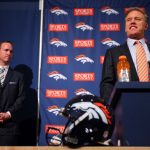 ENGLEWOOD, CO - MARCH 20:  Executive vice president of football operations John Elway (R) speaks as quarterback Peyton Manning stands to his right during a news conference announcing Manning's contract with the Denver Broncos in the team meeting room at the Paul D. Bowlen Memorial Broncos Centre on March 20, 2012 in Englewood, Colorado. Manning, entering his 15th NFL season, was released by the Indianapolis Colts on March 7, 2012, where he had played his whole career. It has been reported that Manning will sign a five-year, $96 million offer.  (Photo by Doug Pensinger/Getty Images)
