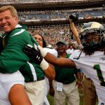DENVER, CO - SEPTEMBER 01:  Head coach Jim McElwain of the Colorado State Rams celebrates with his team after defeating the Colorado Buffaloes 22-17 in the Rocky Mountain Showdown at Sports Authority Field at Mile High on September 1, 2012 in Denver, Colorado.  (Photo by Doug Pensinger/Getty Images)