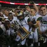 DENVER, CO - AUGUST 29:  The Colorado State Rams celebrate with the Centennial Cup after defeating the the Colorado Buffaloes 31-17 in the Rocky Mountain Showdown at Sports Authority Field at Mile High on August 29, 2014 in Denver, Colorado.  (Photo by Doug Pensinger/Getty Images)