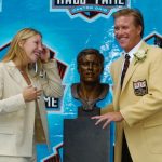 CANTON, OH - AUGUST 8:  Pro Football Hall of Fame enshrinee John Elway (R) and his daughter Jessica Elway (L), who was his presenter, pose with John's bust during the 2004 NFL Hall of Fame enshrinement ceremony August 8, 2004 in Canton, Ohio.  (Photo by David Maxwell/Getty Images)