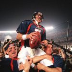 SAN DIEGO, :  Denver Broncos quarterback John Elway (C) is carried by teammates Ed McCaffrey (L) and Bubby Brister (R) after the Broncos defeated the  Green Bay Packers 31-24 to win Super Bowl XXXII in San Diego, CA 25 January.       AFP PHOTO/Timothy A. CLARY (Photo credit should read TIMOTHY A. CLARY/AFP/Getty Images)