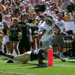 BOULDER, CO - SEPTEMBER 3:  Wide receiver George Hill #27 of the Colorado State Rams dives for the end zone but is knocked out of bounds at the 3-yard line by cornerback Lorenzo Sims #22 of the Colorado Buffaloes at Folsom Field on September 3, 2005 in Boulder, Colorado. Colorado defeated Colorado State 31-28.  (Photo by Doug Pensinger/Getty Images)