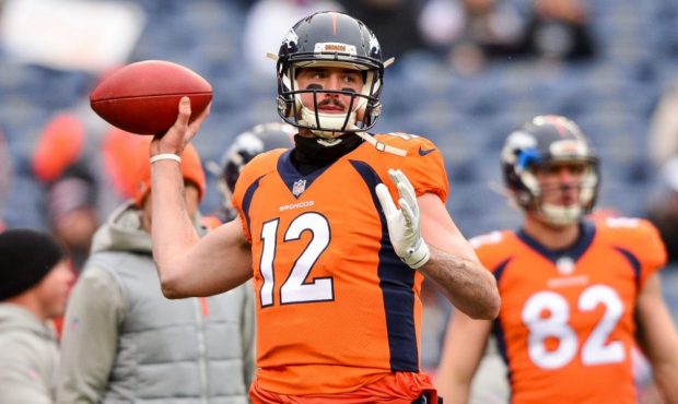 DENVER, CO - DECEMBER 31:  Quarterback Paxton Lynch #12 of the Denver Broncos throws as he warms up...