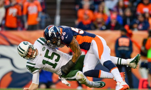 DENVER, CO - DECEMBER 10:  Outside linebacker Shane Ray #56 of the Denver Broncos hits quarterback ...