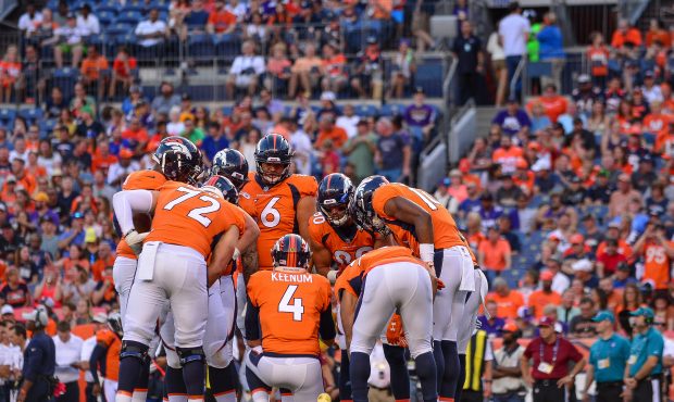 Quarterback Case Keenum #4 of the Denver Broncos runs a huddle in the first quarter during an NFL p...