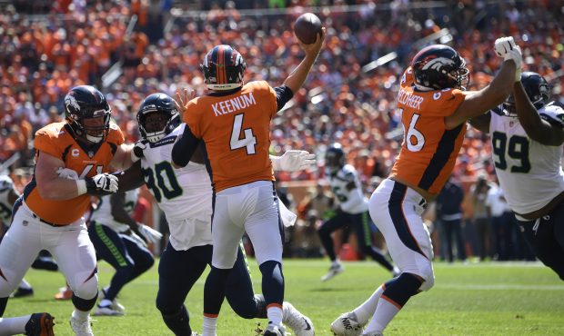 Denver Broncos quarterback Case Keenum (4) looks to pass during the first quarter on Sunday, Septem...