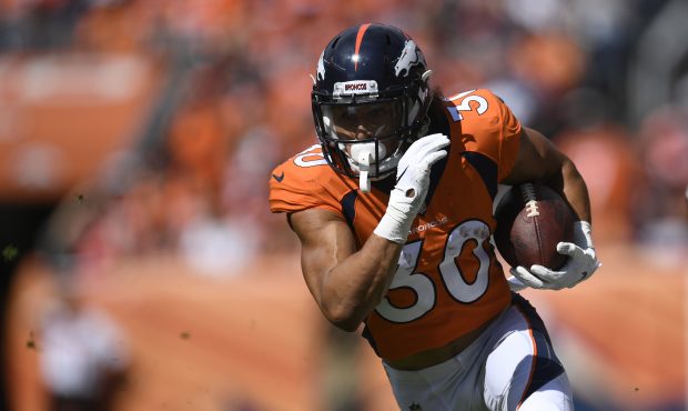 Phillip Lindsay (30) of the Denver Broncos runs after a catch during the first quarter against the ...