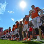 DENVER, CO - SEPTEMBER 16:  Denver Broncos players including offensive tackle Garett Bolles #72 stand during the national anthem before a game against the Oakland Raiders at Broncos Stadium at Mile High on September 16, 2018 in Denver, Colorado. (Photo by Dustin Bradford/Getty Images)