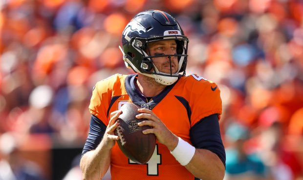 Quarterback Case Keenum #4 of the Denver Broncos looks downfield in the first quarter of a game aga...