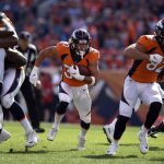 DENVER, CO - SEPTEMBER 16, 2018:  Running back Phillip Lindsay (30) of the Denver Broncos finds a hole and gains some yards during the third quarter on Sunday, September 16 at Broncos Stadium at Mile High. The Denver Broncos hosted the Oakland Raiders for the second game of the season. (Photo by Eric Lutzens/The Denver Post via Getty Images)