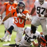DENVER, CO - SEPTEMBER 16:  Running back Phillip Lindsay #30 of the Denver Broncos rushes against the Oakland Raiders at Broncos Stadium at Mile High on September 16, 2018 in Denver, Colorado. (Photo by Matthew Stockman/Getty Images)