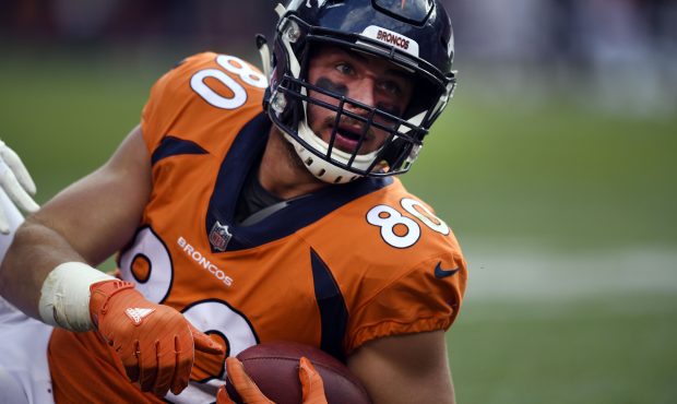 Tight end Jake Butt (80) of the Denver Broncos sits on the field after pulling in a short catch dur...