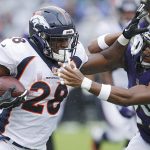 Royce Freeman #28 of the Denver Broncos runs the ball while defended by Marlon Humphrey #29 of the Baltimore Ravens in the first quarter of the game at M&T Bank Stadium on September 23, 2018 in Baltimore, Maryland. (Photo by Joe Robbins/Getty Images)