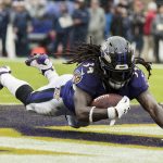 Alex Collins #34 of the Baltimore Ravens scores a touchdown against the Denver Broncos during the first half at M&T Bank Stadium on September 23, 2018 in Baltimore, MD.  (Photo by Scott Taetsch/Getty Images)