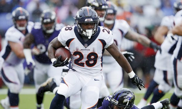Royce Freeman #28 of the Denver Broncos runs the ball during the game against the Baltimore Ravens ...