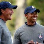 Tiger Woods and Phil Mickelson of the USA share a joke during the second preview day of The 39th Ryder Cup at Medinah Country Golf Club on September 25, 2012 in Medinah, Illinois.  (Photo by Jamie Squire/Getty Images)