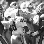 SEP 25 1989; Football - Denver Broncos - 1989 September Games; Scott Davis of the Raiders and Broncos Keith Bishop mix it up during the Raiders, Broncos game at Mile High.;  (Photo By Brian Brainerd/The Denver Post via Getty Images)