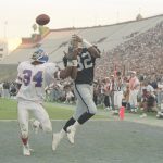 2 Jan 1994:  Wide receiver James Jett of the Los Angeles Raiders (right) and Denver Broncos defensive back Tyrone Braxton look for the ball during a game at the Los Angeles Memorial Coliseum in Los Angeles, California.  The Raiders won the game, 33-30. Ma