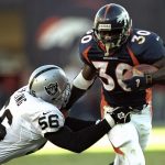 22 Nov 1998:  Running back Terrell Davis #30 of the Denver Broncos in action against defensive end Pat Swilling #56 of the Oakland Raiders during the game at the Mile High Stadium in Denver, Colorado. The Broncos defeated the Raiders 40-14. Mandatory Credit: Vincent Laforet  /Allsport