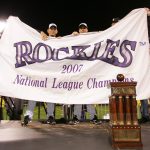 DENVER - OCTOBER 15:  Members of the Colorado Rockies celebrate with a banner and the trophy after they won 6-4  against the Arizona Diamondbacks during Game Four of the National League Championship Series at Coors Field on October 15, 2007 in Denver, Colorado. The Rockies defeated the Diamondbacks 6-4 to sweep the series 4-0.  (Photo by Doug Pensinger/Getty Images)