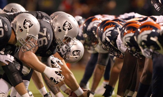 The Denver Broncos defense line up against the Oakland Raiders offense during the NFL game against ...
