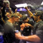 DENVER - OCTOBER 01:  Ryan Spilborghs (R) and his teammates shower manager Jim Tracy (L) of the Colorado Rockies as celebrate in the clubhouse after they defeated the Milwaukee Brewers 9-2 and clinched a National League playoff berth at Coors Field on October 1, 2009 in Denver, Colorado.  (Photo by Doug Pensinger/Getty Images)