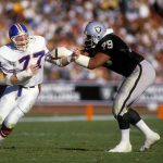 LOS ANGELES, CA - CIRCA 1980's: Linebacker Karl Mecklenburg #77 of the Denver Broncos tries to get around tackle Bruce Davis #79 of the Los Angeles Raiders circa mid 1980's  during an NFL football game at the Los Angeles Coliseum in Los Angeles, California. Mecklenburg played for the Broncos from 1983-94. (Photo by Focus on Sport/Getty Images)