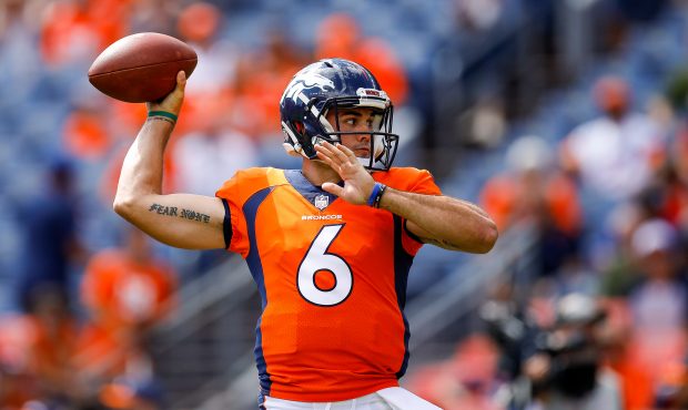 Quarterback Chad Kelly #6 of the Denver Broncos throws as he warms up before a game against the Oak...