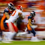 Running back Phillip Lindsay #30 of the Denver Broncos returns a kickoff against the Kansas City Chiefs in a slow shutter exposure at Broncos Stadium at Mile High on October 1, 2018 in Denver, Colorado. (Photo by Justin Edmonds/Getty Images)