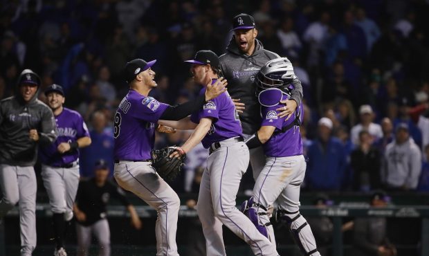 The Colorado Rockies celebrate defeating the Chicago Cubs 2-1 in thirteen innings to win the Nation...