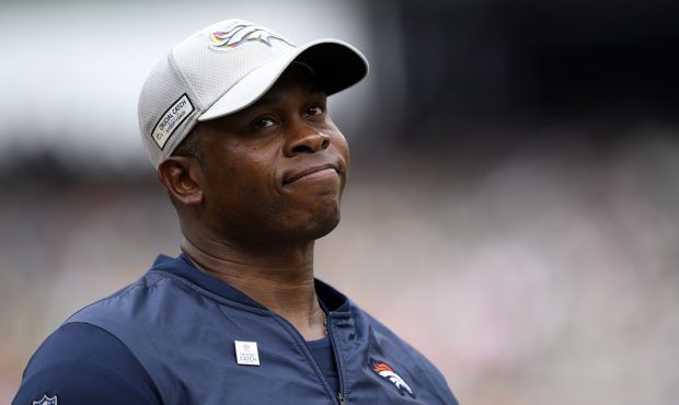 Head coach Vance Joseph of the Denver Broncos looks at the big screen reviewing a play during the f...