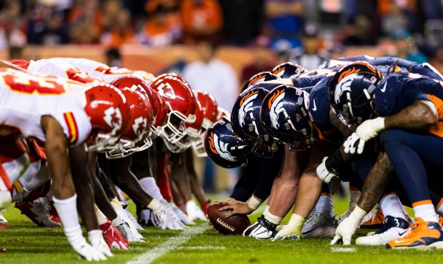 Kansas City Chiefs defense and Denver Broncos offense at the line of scrimmage before an extra poin...