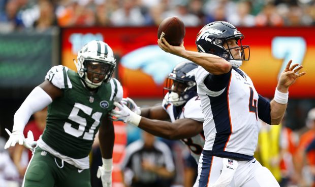 Case Keenum #4 of the Denver Broncos looks to pass against the New York Jets during the first half ...