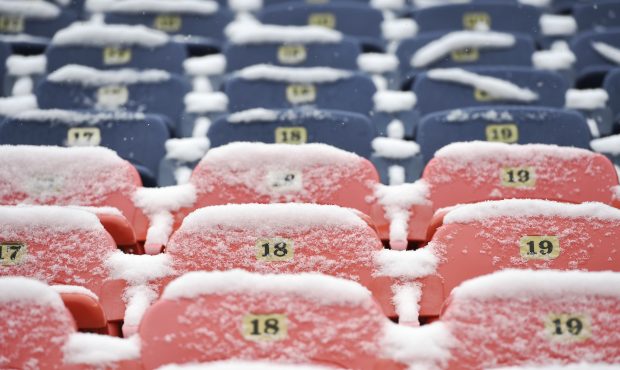 Snow covered seats in the north end zone at Broncos Stadium at Mile High before the Denver Broncos ...