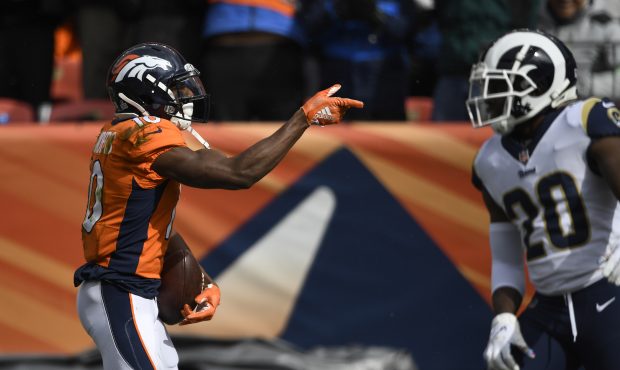 Emmanuel Sanders (10) of the Denver Broncos taunts and Troy Hill (32) of the Los Angeles Rams and i...