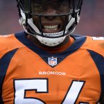 DENVER, CO - OCTOBER 14, 2018:  Linebacker Brandon Marshall #54 of the Denver Broncos winces as he walks toward the sideline during the second quarter on Sunday, October 14 at Broncos Stadium at Mile High. The Denver Broncos hosted the Los Angeles Rams in week six. (Photo by Eric Lutzens/The Denver Post via Getty Images)
