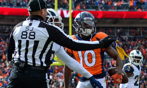 Wide receiver Emmanuel Sanders #10 of the Denver Broncos celebrates after a catch and draws a taunt...