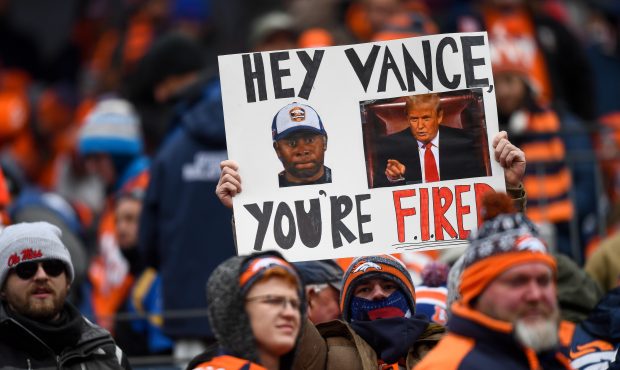 A Denver Broncos fan holds a sign asking for the firing of head coach Vance Joseph of the Denver Br...