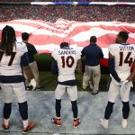 Offensive tackle Billy Turner #77, wide receiver Emmanuel Sanders #10 and wide receiver Courtland Sutton #14 of the Denver Broncos stand for the National Anthem before the game against the Arizona Cardinals at State Farm Stadium on October 18, 2018 in Glendale, Arizona. (Photo by Christian Petersen/Getty Images)