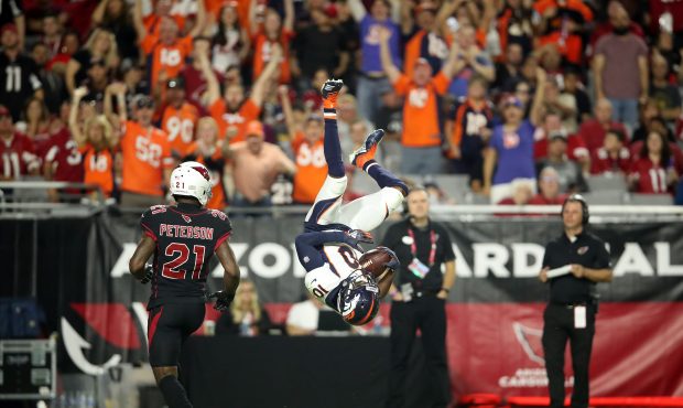 Wide receiver Emmanuel Sanders #10 of the Denver Broncos flips in to the end zone after catching a ...