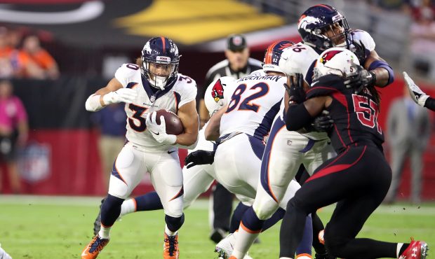 Running back Phillip Lindsay #30 of the Denver Broncos runs during the first half against the Arizo...