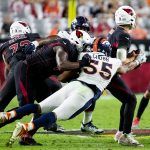 Denver Broncos linebacker Bradley Chubb (55) strips the ball from the quarterback during NFL football game between the Arizona Cardinals and the Denver Broncos on October 18, 2018 at State Farm Stadium in Glendale, Arizona (Photo by Adam Bow/Icon Sportswire via Getty Images)