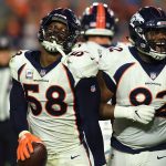Von Miller #58 and Zach Kerr #92 of the Denver Broncos celebrate Millers strip and  recovery of a  fumble in the second half of their 45-10 win at State Farm Stadium on October 18, 2018 in Glendale, Arizona. (Photo by Joe Amon/The Denver Post via Getty Images)