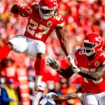 KANSAS CITY, MO - OCTOBER 28: Kareem Hunt #27 of the Kansas City Chiefs leaps over a defender on his way to a touchdown during the third quarter of the game against the Denver Broncos at Arrowhead Stadium on October 28, 2018 in Kansas City, Missouri. (Photo by David Eulitt/Getty Images)