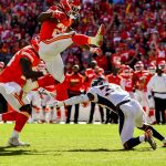 KANSAS CITY, MO - OCTOBER 28: Kareem Hunt #27 of the Kansas City Chiefs hurdles over Will Parks #34 of the Denver Broncos on his way to an impressive touchdown run during the third quarter of the game at Arrowhead Stadium on October 28, 2018 in Kansas City, Missouri. (Photo by Peter Aiken/Getty Images)