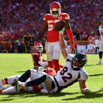 KANSAS CITY, MO - OCTOBER 28: Jeff Heuerman #82 of the Denver Broncos holds up the ball after catching a touchdown pass in front of Eric Murray #21 of the Kansas City Chiefs during the second half of the game at Arrowhead Stadium on October 28, 2018 in Kansas City, Missouri. (Photo by Peter Aiken/Getty Images)
